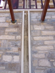 Detail showing the stone water channels used instead of plastic guttering