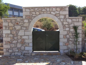 Gate with machine cut stone arch.