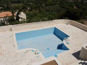 Swimming pool and extensive patio area.