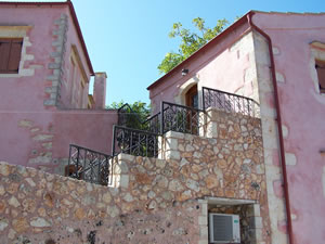 Two rendered stone villas.